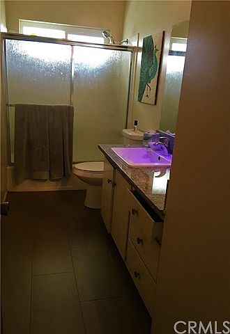 Apartment bathroom with tiled shower
