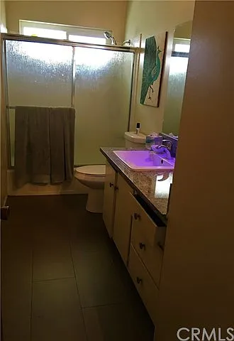 Apartment bathroom with tiled shower