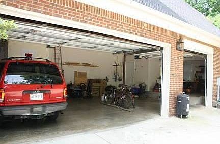 Oversized 3-car garage : Ample storage. Work shop on right side. Closet for storing atheltic equipme