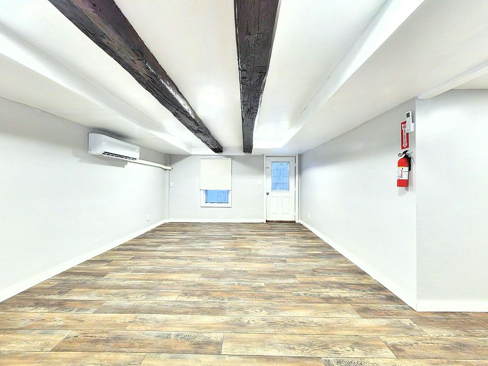 "A sparkling clean, spa-inspired bathroom featuring modern fixtures and bright lighting."