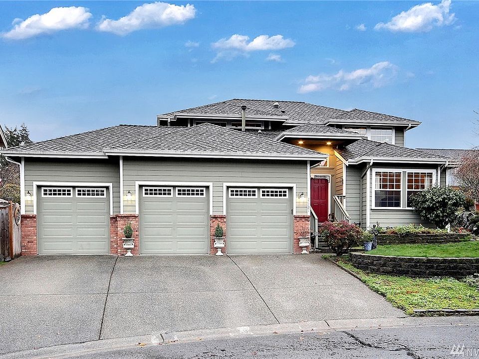 A three car garage and newer presidential composition 50 year roof!