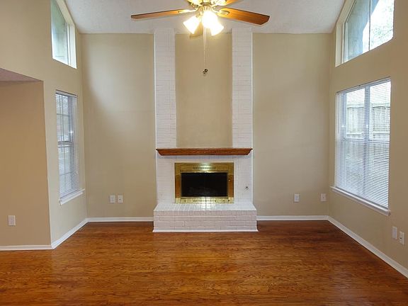 Fireplace is great in living room with open flow of kitchen and dining.