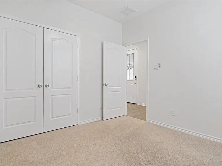 Secondary bedroom at the front of the home