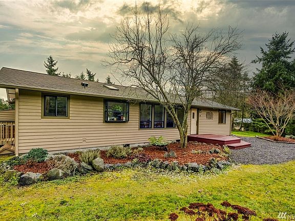 Front of the home.  Notice the skylights which bring in the wonderful light for the property.