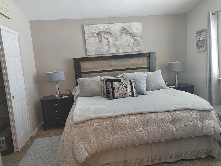 Master bedroom has room for king size bed, two night stands and dresser, wall moubnted big screen tv