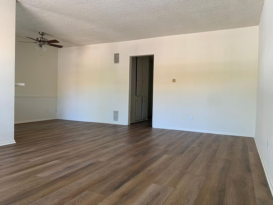 Spacious living room with room for breakfast dining area.