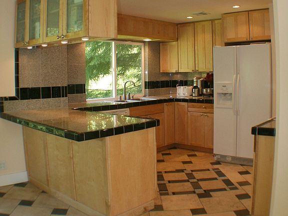 Great working kitchen w/ granite, travertine, slate and maple. 