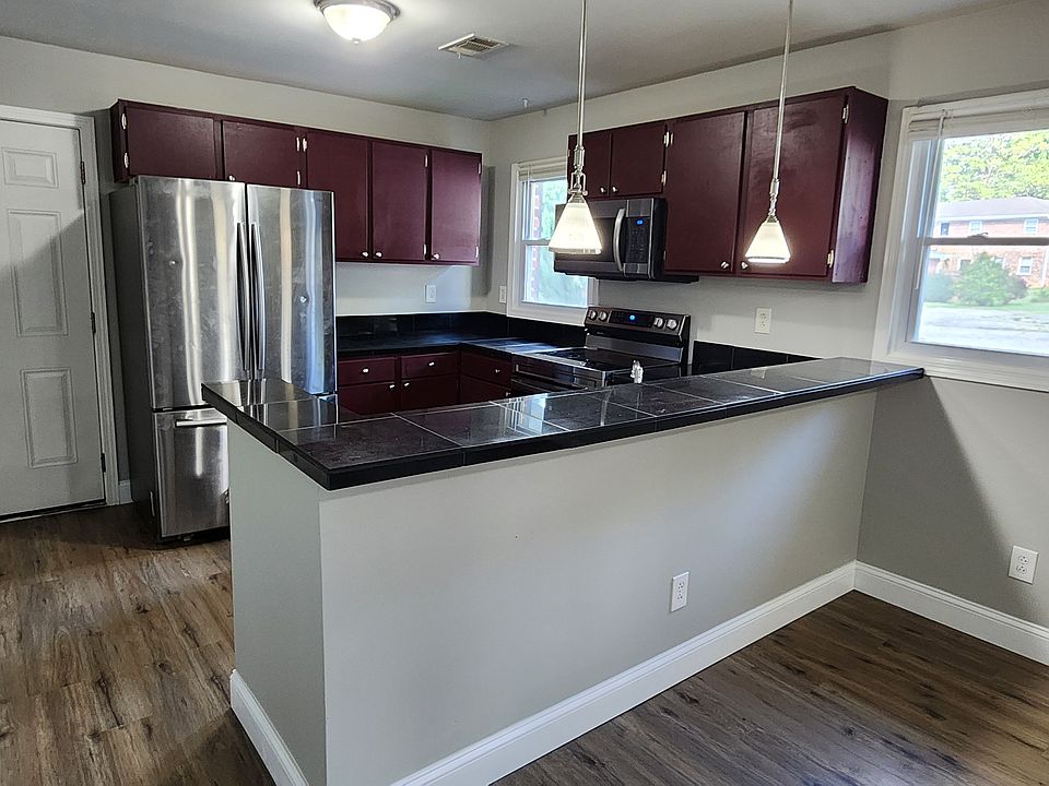 Kitchen with new appliances and eat at bar