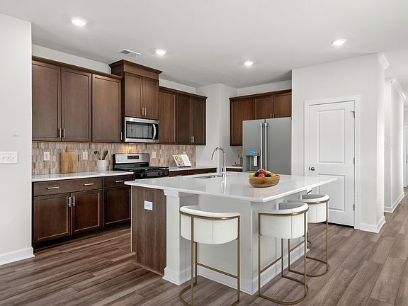 Prepare your favorite meals or catch up with friends at the oversized kitchen island.