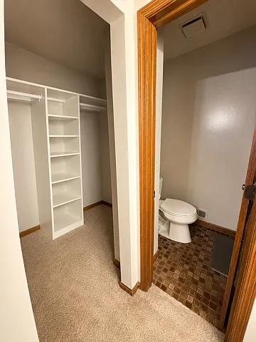 Master Bedroom walk-in closet and 3/4 bath with shower.