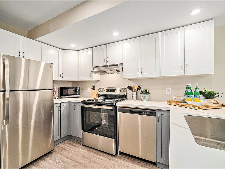 Fully stocked kitchen with modern appliances in an Ottawa suite.