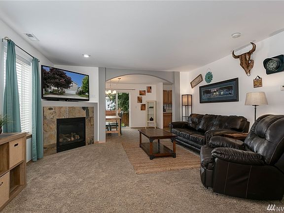Large living room with lots of windows for light 