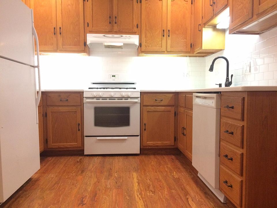 Recently updated kitchen with new quartz counter top and white subway tile.