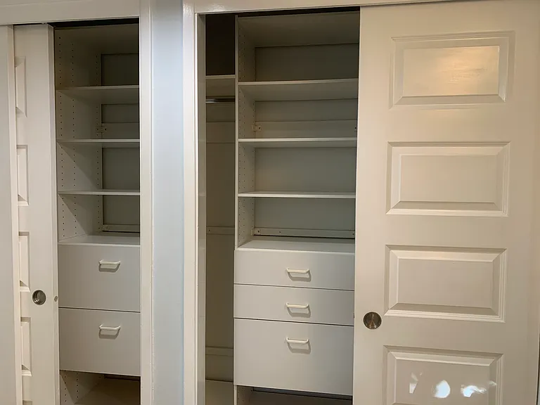 Custom closet system in the primary suite