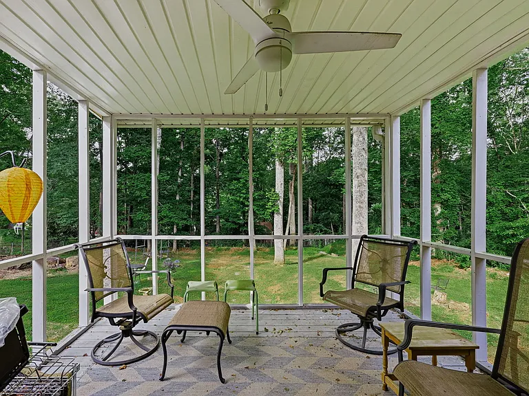 MAIN LEVEL: Back Porch with seating and ceiling fan)