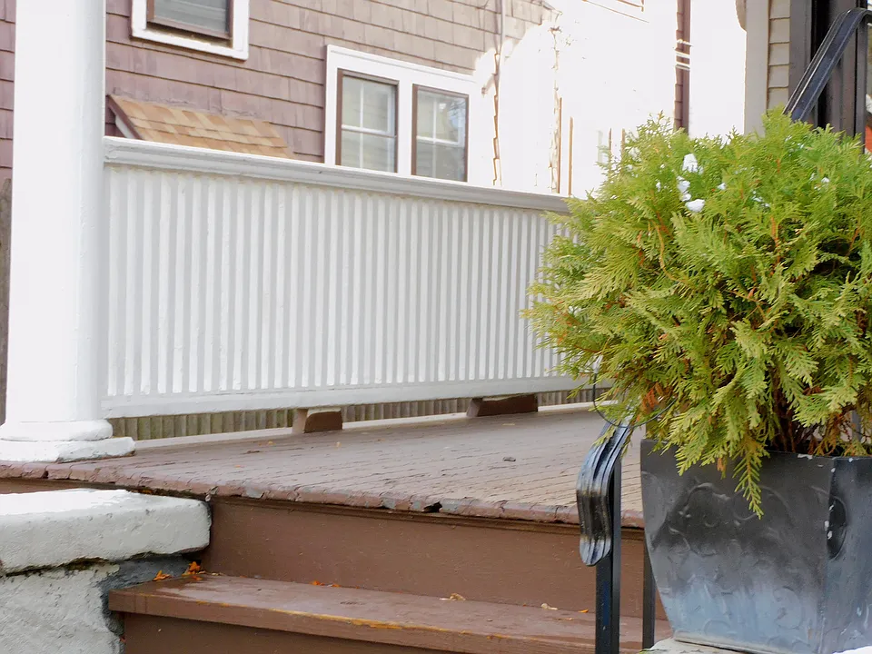 Entry through your own private porch , perfect for watching the avenue go by