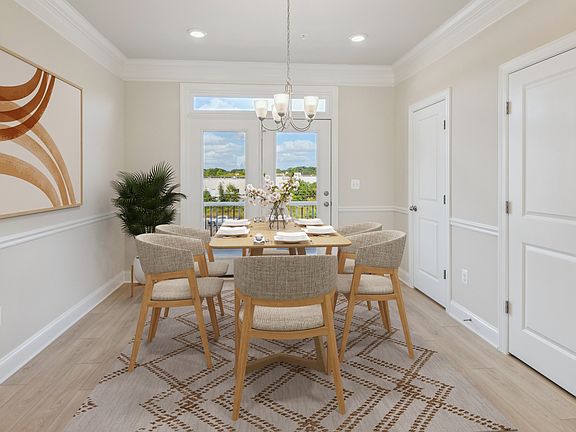 Dining Area with LVP Floors and Window Double Doors in a DRB Homes Virtually Staged Edson II