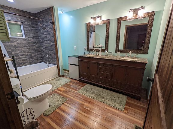 Master bathroom is spacious with double vanity and jetted soaking tub