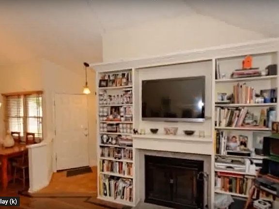 Entrance door to the house. To the left dining area. To the right is the living room. All hardwood floors.