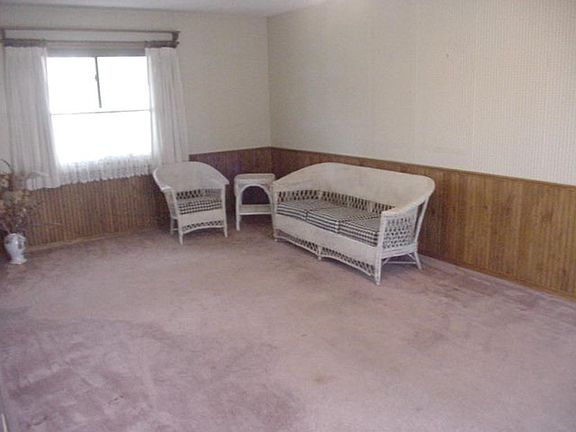 MAIN FLOOR FAMILY ROOM THAT HAS SLIDING DOOR TO PATIO