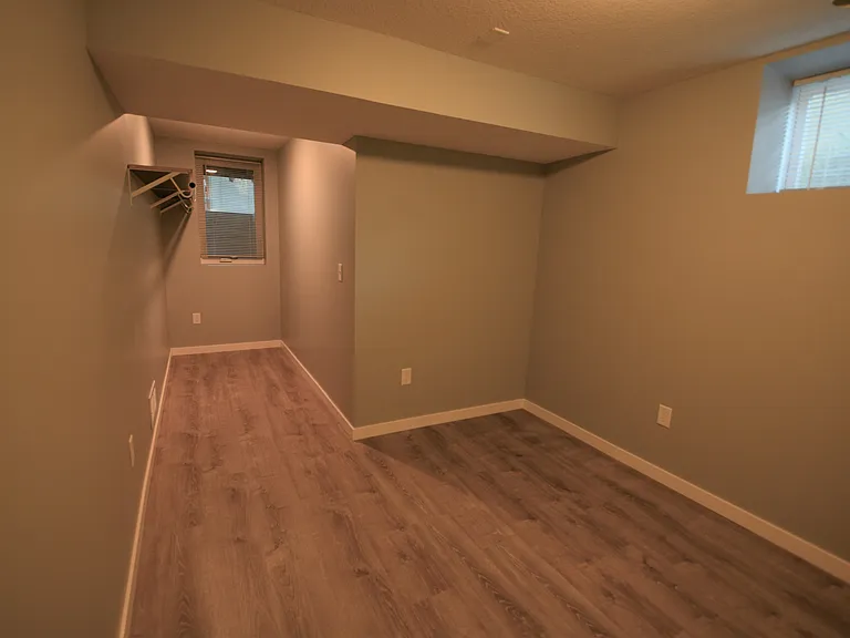 Basement Bedroom #5 . 8.8' X 9.7' open walk in closet 3.9' X 9.7'