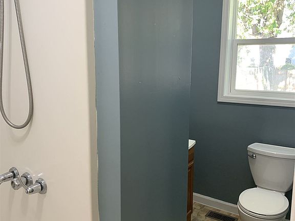 bathroom with full tub