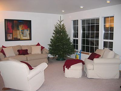 Large living room with recessed lights.