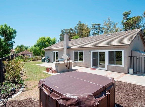 Backyard looking toward back of home with ALL new windows and sliders.