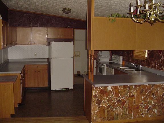 The kitchen with a breakfast bar.