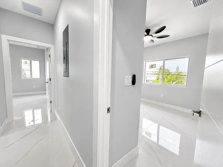 Hallway to the 3rd bedroom and the Primary Bedroom