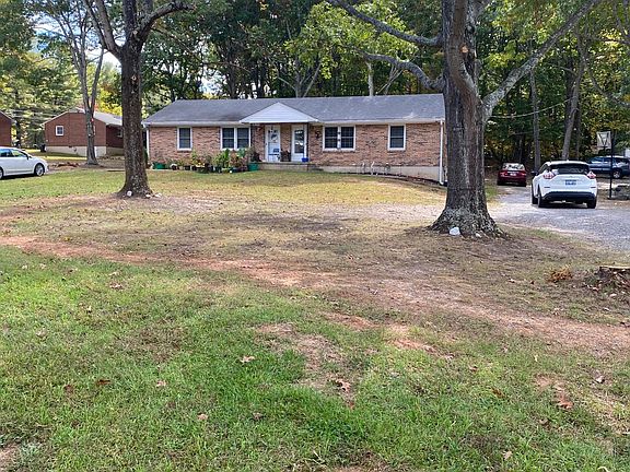 Big front yard. Long drive that goes around to back of house,too.