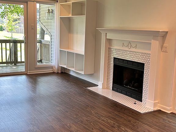 LR has gas log (ceramic balls) fireplace with built-in entertainment center.