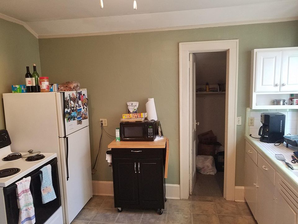 Showing rest of kitchen. Pantry door straight ahead.