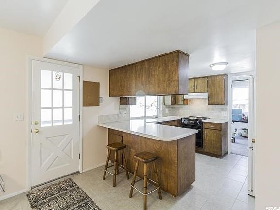 Spacious kitchen with bar stools!