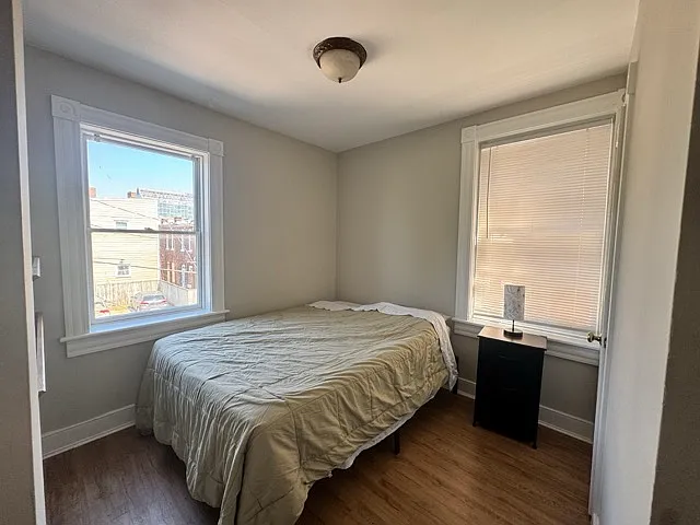 Bedroom next to the upstairs bathroom with a closet and an area to use the laptop.