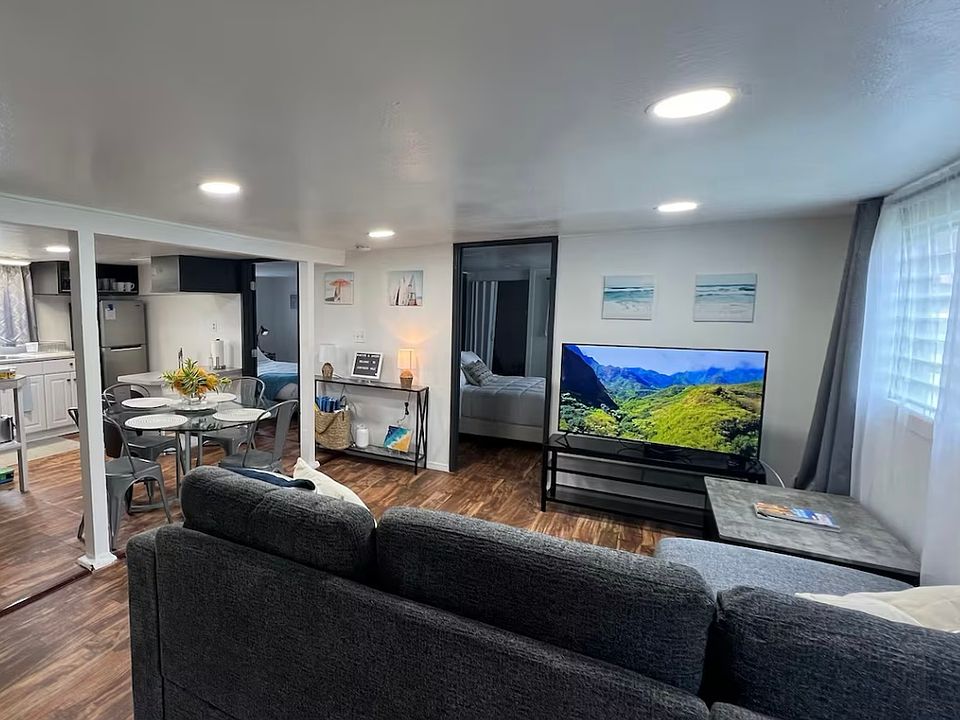 Open area for living room and dining room.
Living room area has window AC