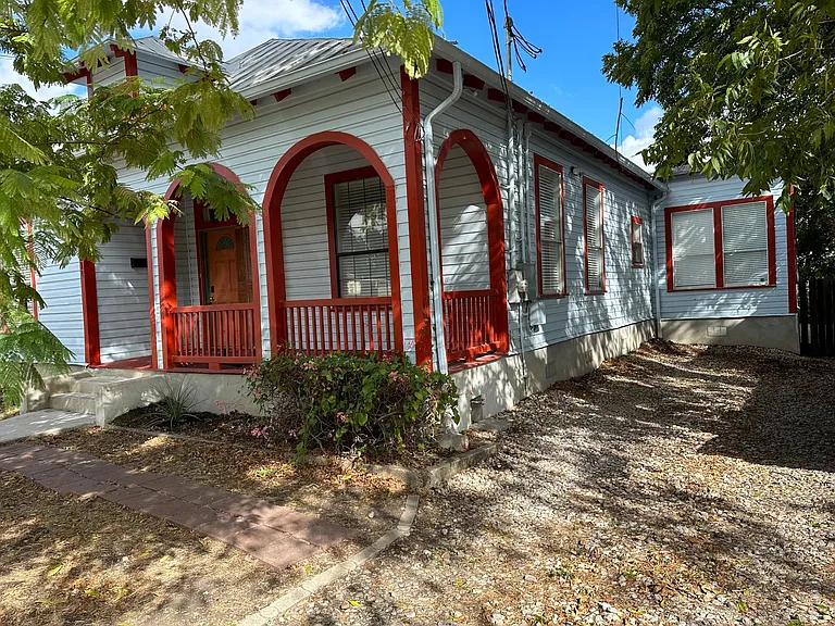 Front driveway is 70' plenty of room for two cars +. Covered front porch.