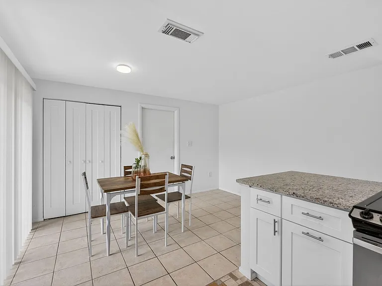 Dining Area with nearby pantry storage.