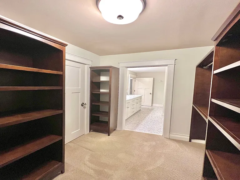 Walk-in closet with bathroom attached