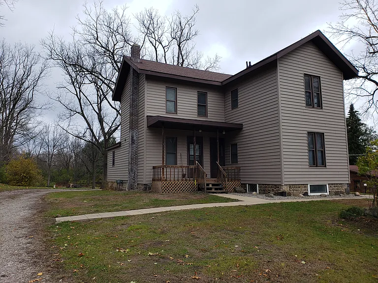 Front of the home for the downstairs apartment entrances