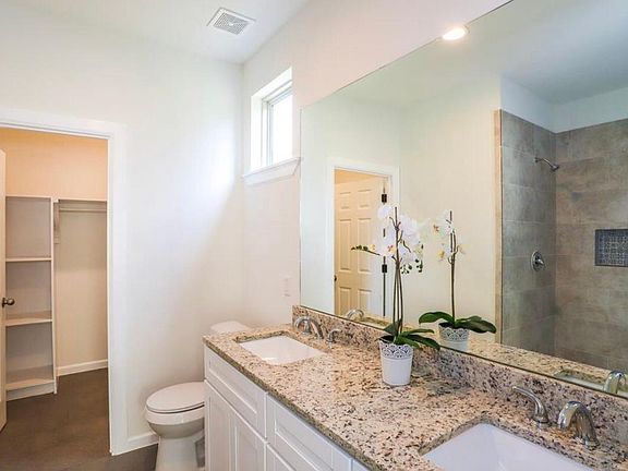 large master bath with two sinks and extra large closet. roomy shower