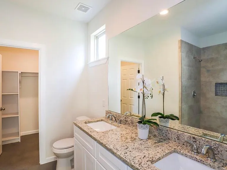 large master bath with two sinks and extra large closet. roomy shower