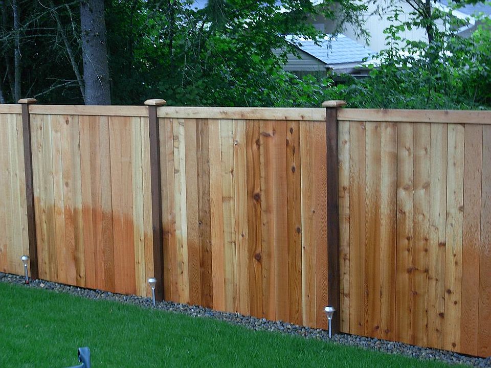 Fenced back yard, sprinklers, green belt behind