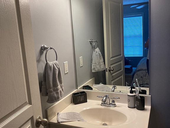 Each of the two bedrooms has a full bathroom, shower-tub, toilet, cabineted sink. Tile flooring.