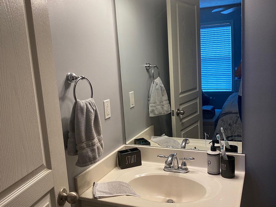 Each of the two bedrooms has a full bathroom, shower-tub, toilet, cabineted sink. Tile flooring.