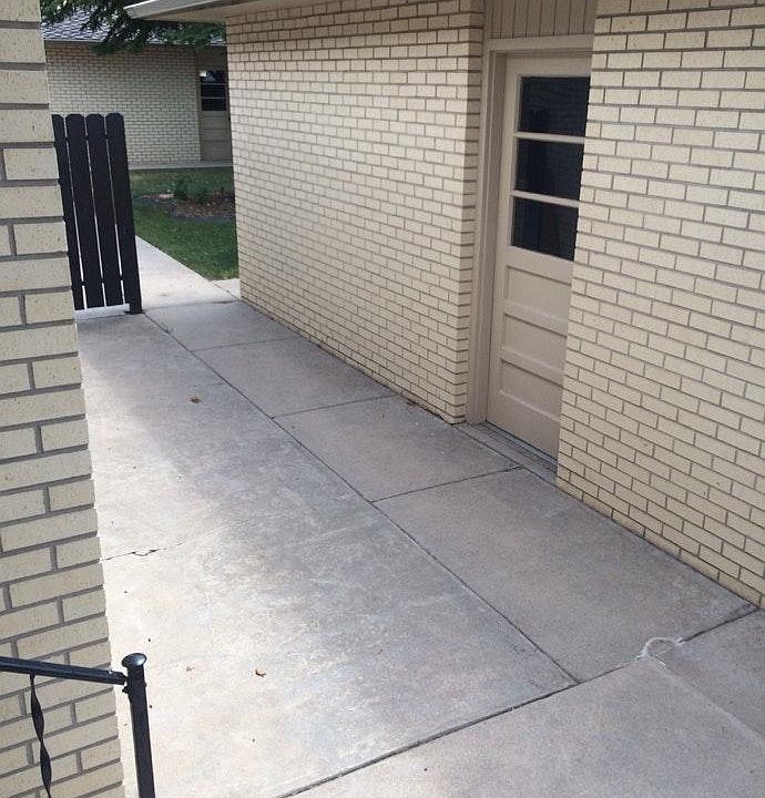 Patio area leading to detached garage