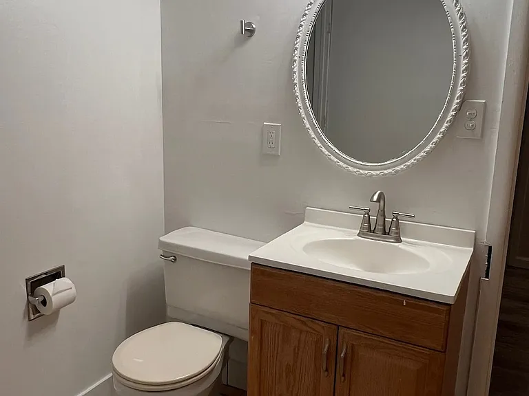 Basement half-bathroom. New hardware.