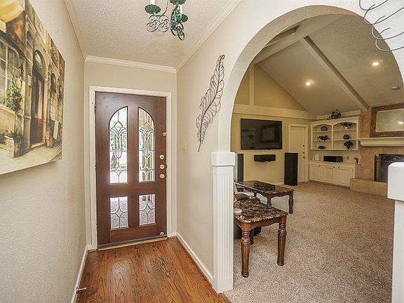 Gorgeous glass front door greets you as you enter. Family room on the left of entry (on the right in this photo)