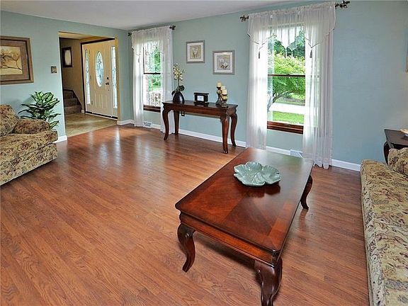 Upgraded laminate flooring and large double windows.