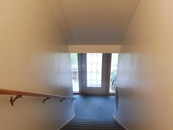 private secured entrance vestibule- (upstairs looking down to beautiful glass door entrance)